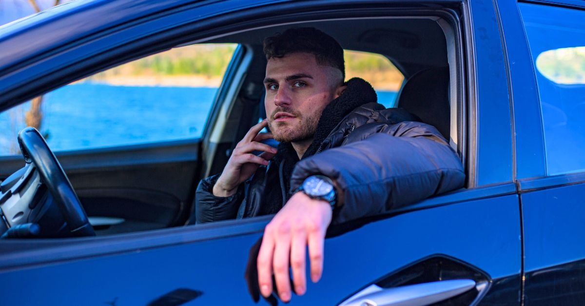 A man sitting in a car