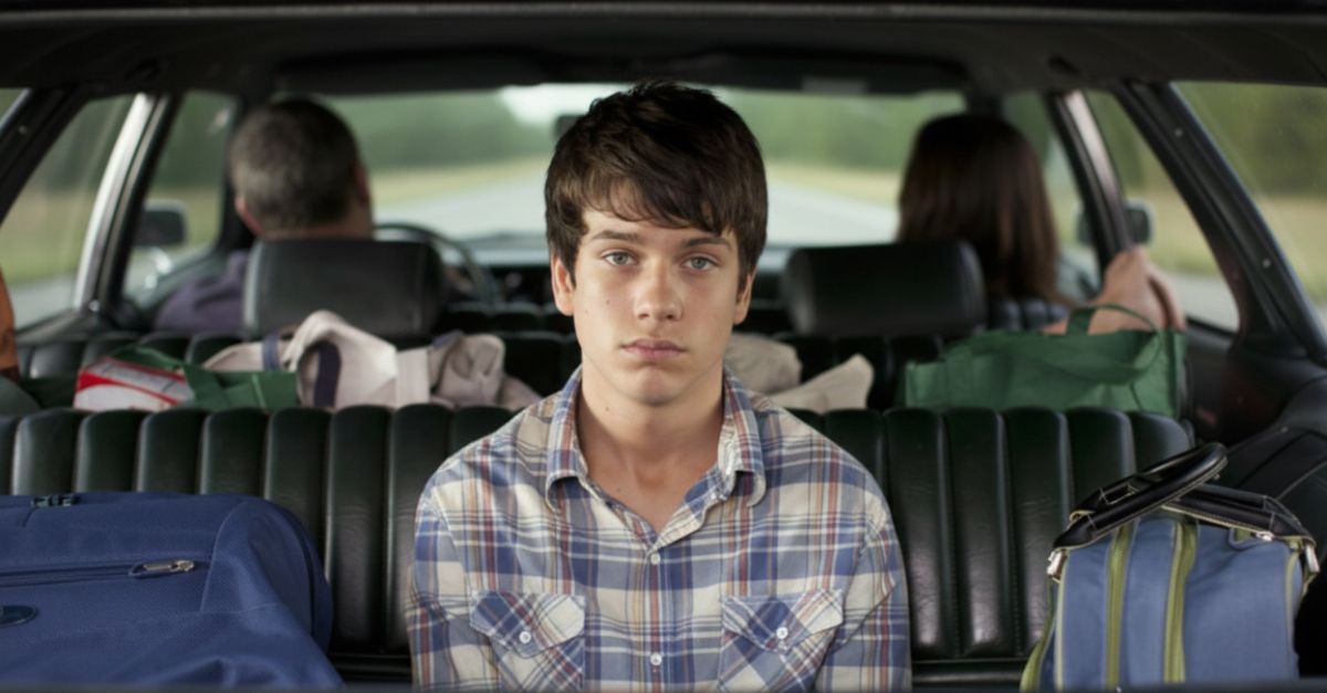 Boy sitting on a way-back seat