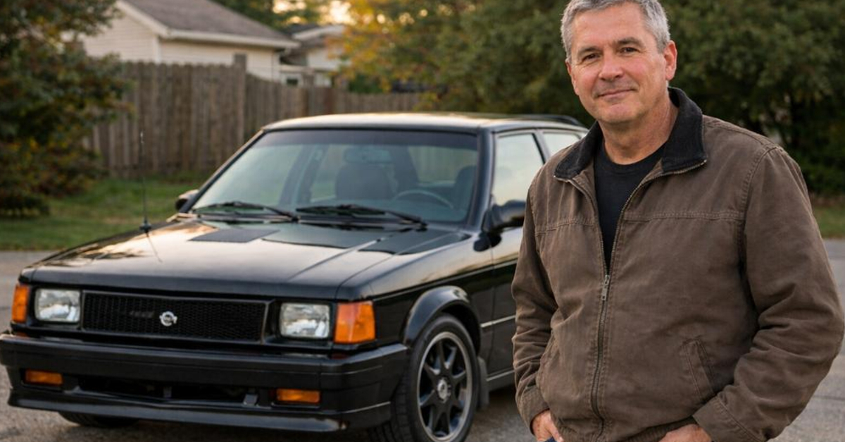 Man standing in front of Dodge Omni Glhs
