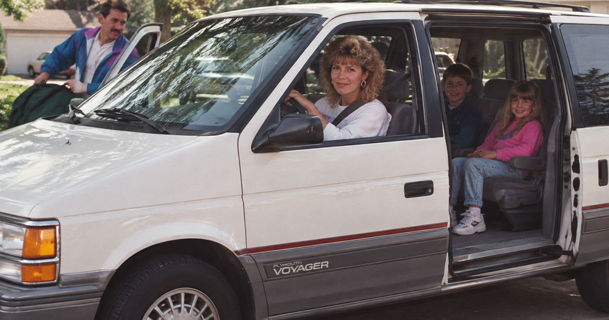 A family in a minivan in the 1990s