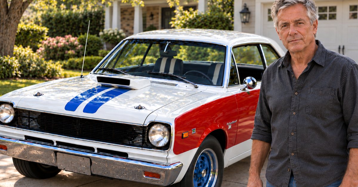 Man standing in front of a muscle car in driveway