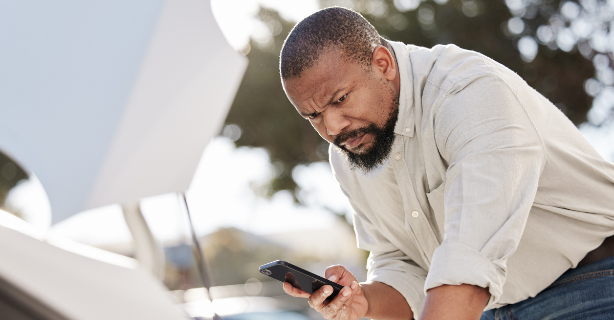 Breakdown, cellphone and black man by car