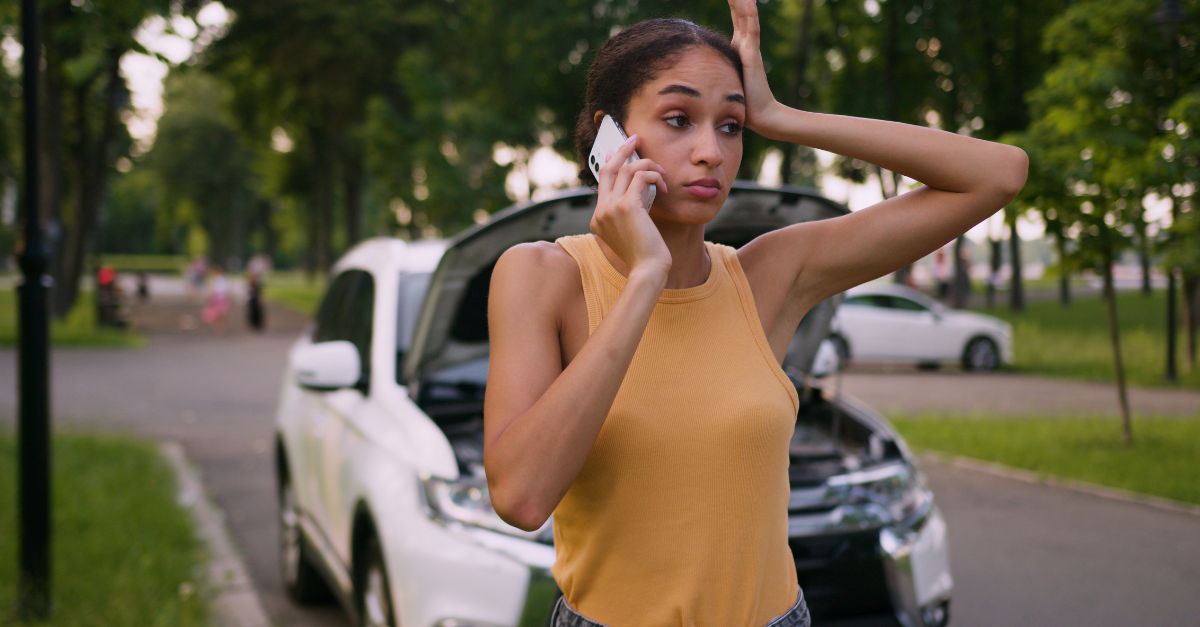 Worried African American woman talking mobile phone