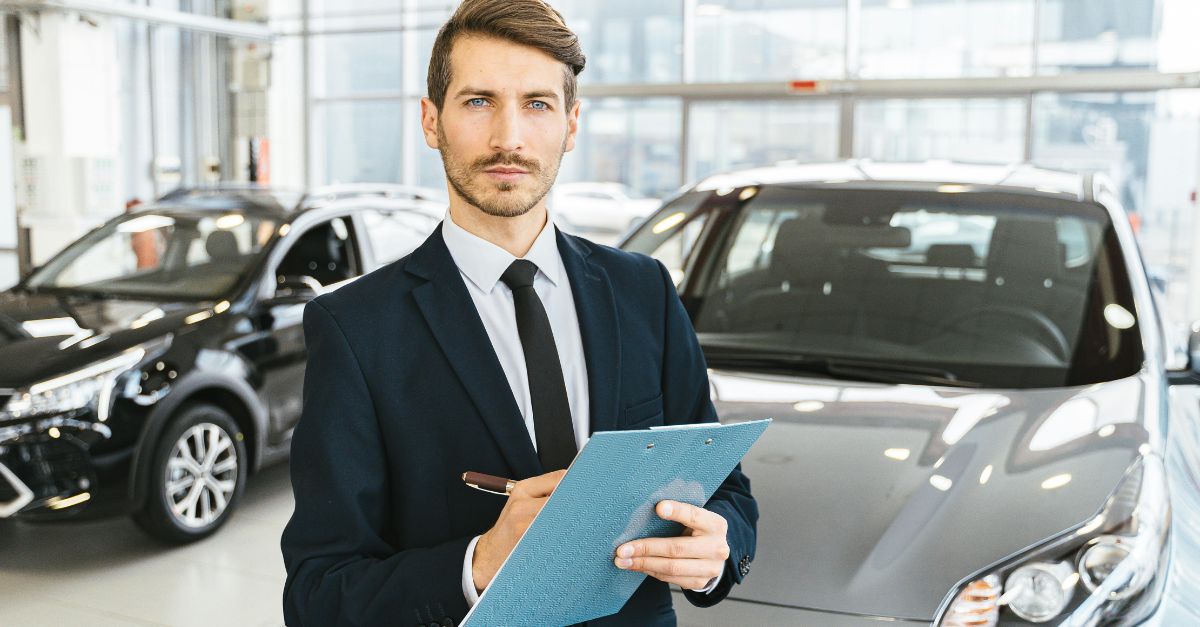 Man in Blue Business Attire Holding Blue Folder