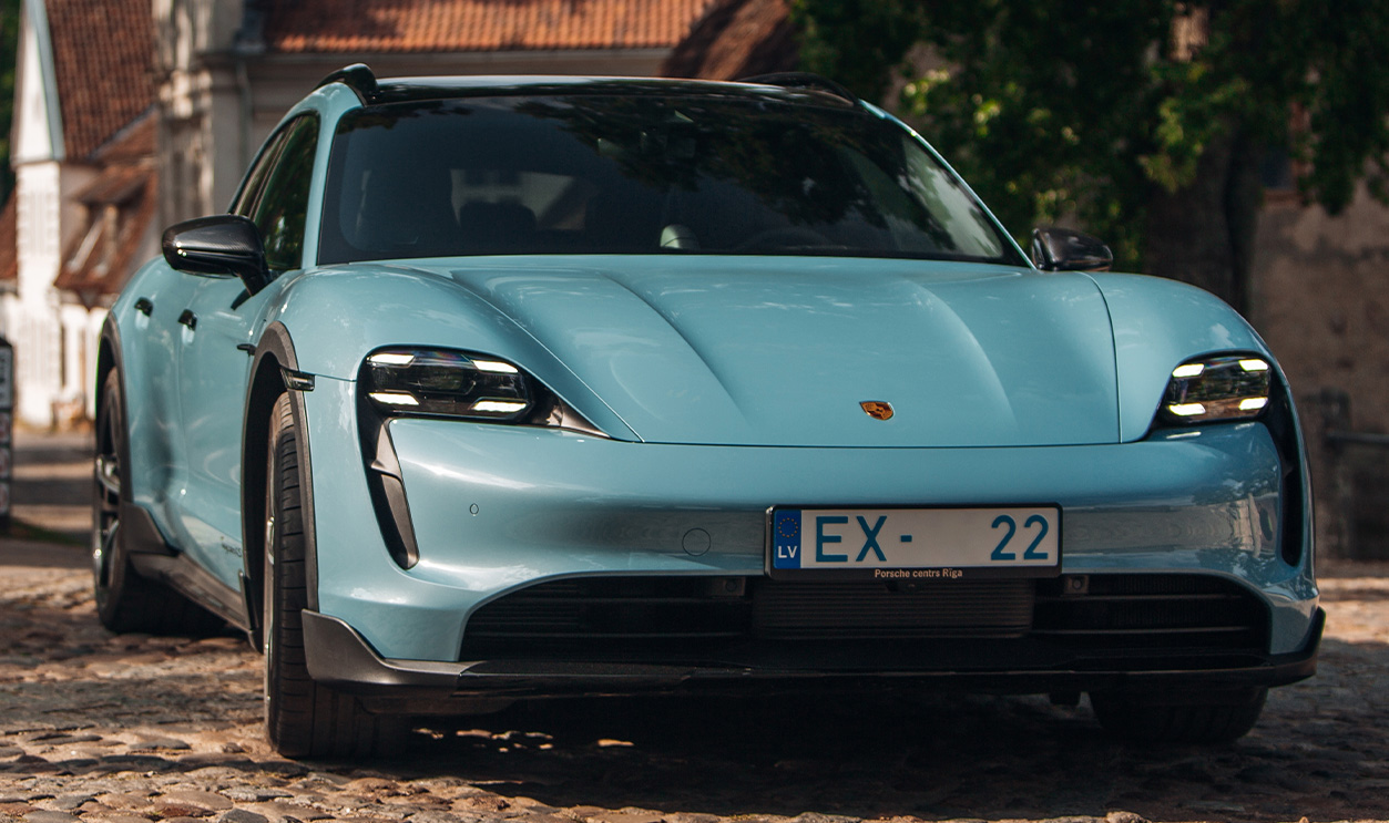 A light blue Porsche Taycan Turbo S Cross Turismo