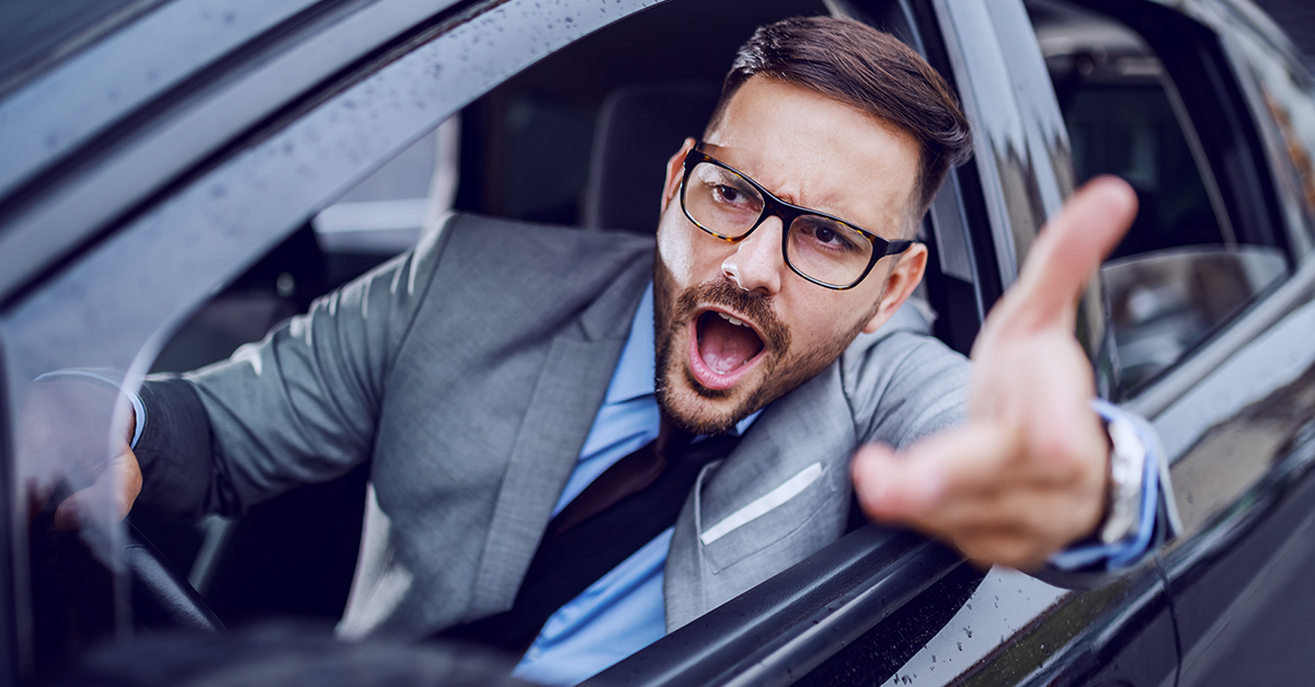 Angry businessman with road rage.