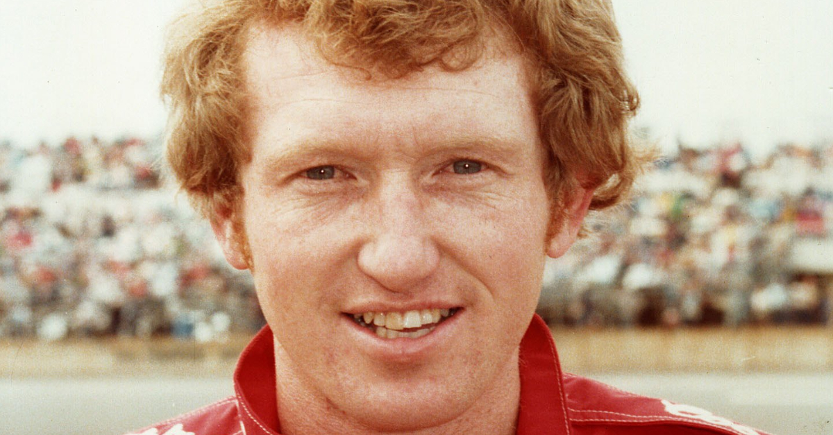 Bill Elliott driver of the #9 Coors Ford looks on before a race circa 1986