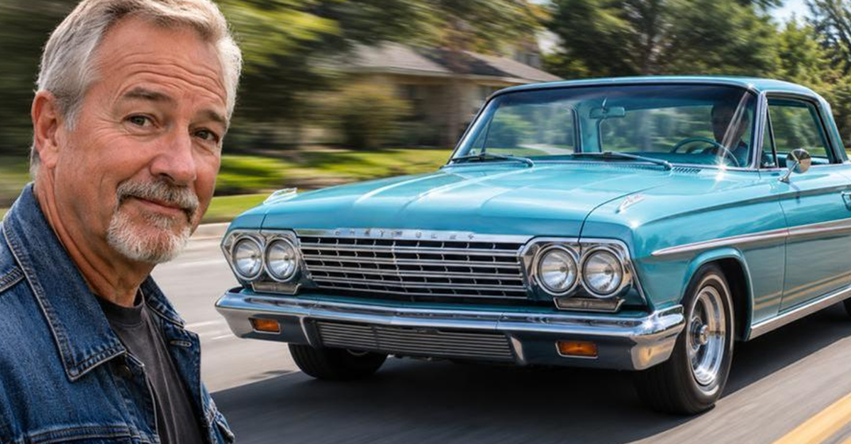 man looking at camera, classic car driving in background