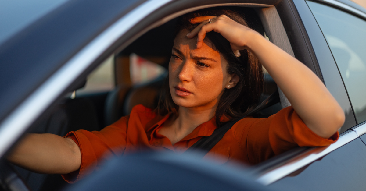 Nervous female driver sits at wheel
