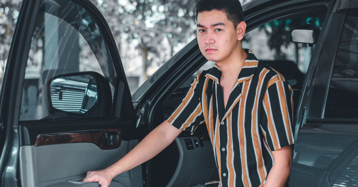 /a-man-getting-out-of-a-car