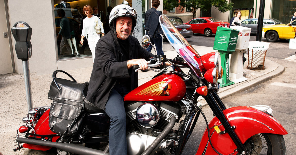 Musician Billy Joel sits on his customized Kawaski Drifter on Madison Avenue October 6, 2002 in New York City