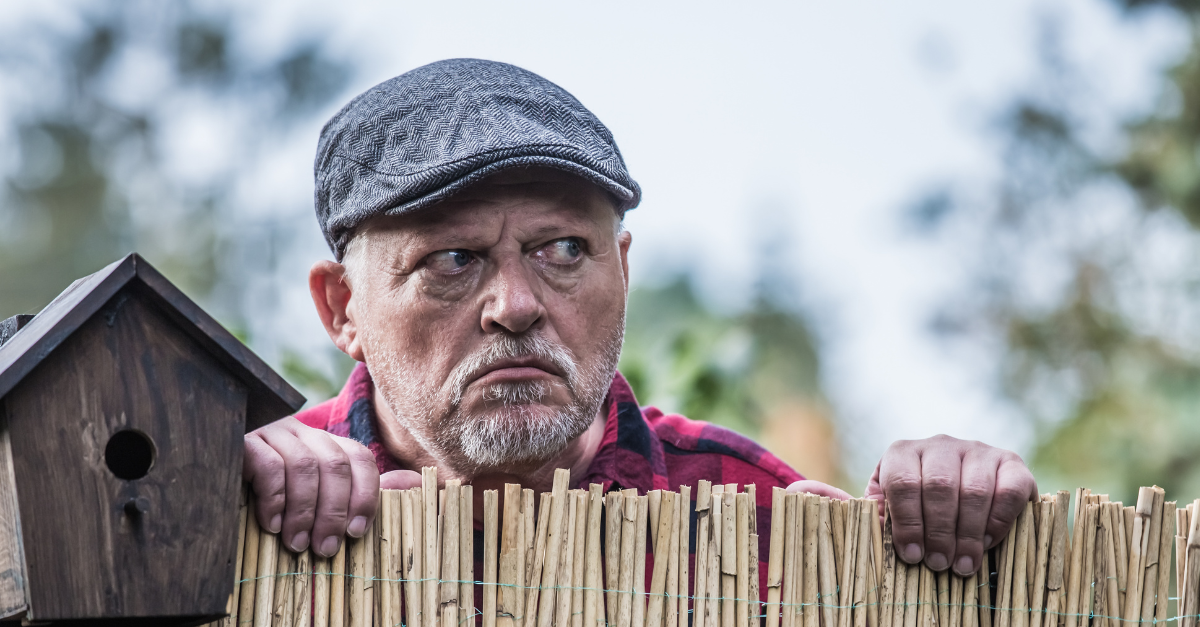 aggressive man watches his neighborhood